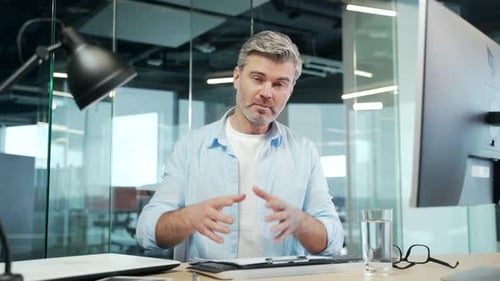 Confident Man Talking in Modern Office