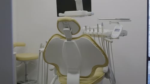 slow reveal dentist chair in bright office