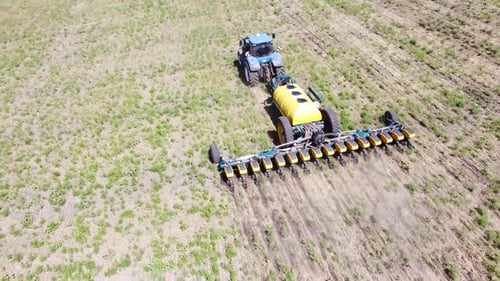 Blue Tractor O.A. Planting Canola On No Till Field