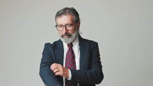 Man in Suit Adjusting Sleeves Cuffs