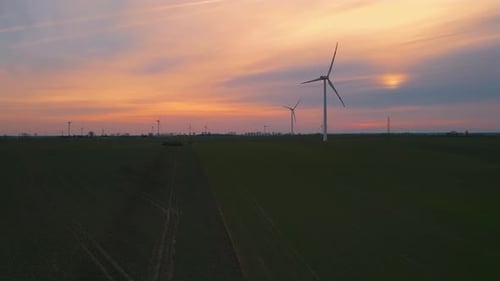 Group of Wind Turbines on Wind Farm Field Generating Clean Renewable Energy for Sustainable