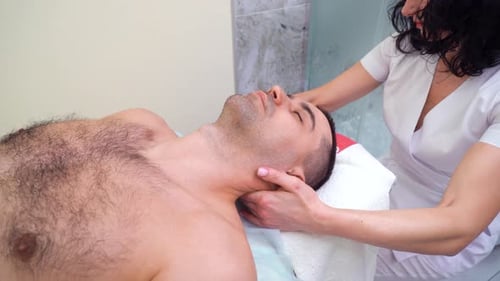 Man Receives Relaxing Neck and Shoulder Massage