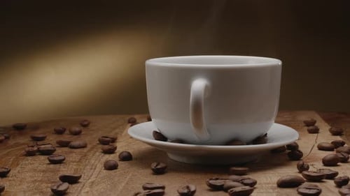 Steaming Coffee Cup with Roasted Coffee Beans