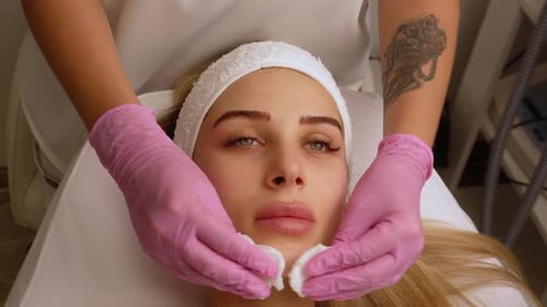 Woman Receiving a Facial with Cotton Balls