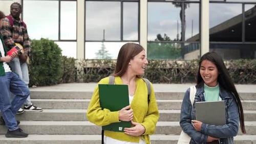 Happy Multiracial Student Girls Walking and Talking Outdoors University After Classes