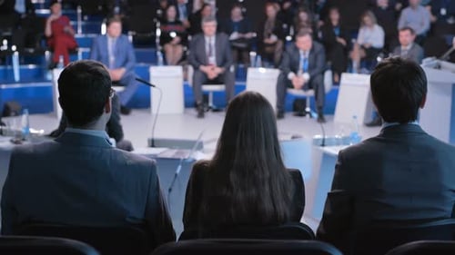 Audience at Corporate Event Listening to Presentation
