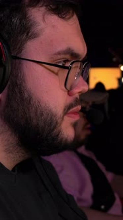 Gamer In Intense Focus Tense Gamer Passionately Engages In Latenight Online Competition Streaming