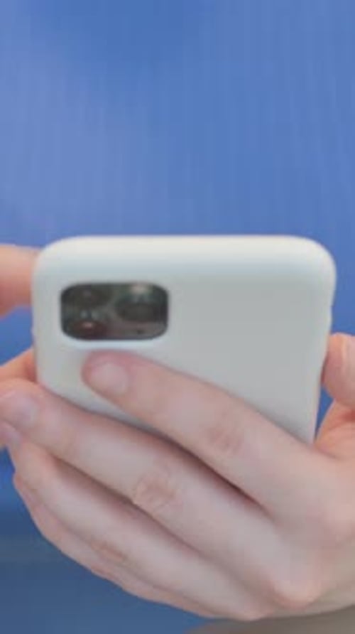 Close up of Woman Using Smartphone, vertical video