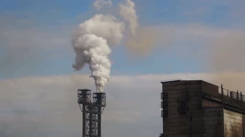 Smoke From Pipes of the Industrial Plant in the City