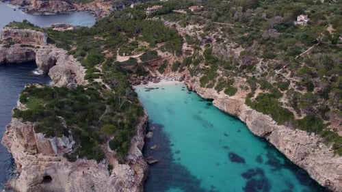 Aerial view of rocky coast and turquoise water, S'Almonia, Mallorca, Spain.