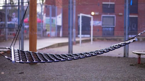 Playground during Covid-19 Coronavirus pandemic, empty scenery during lockdown, hammac swinging in s