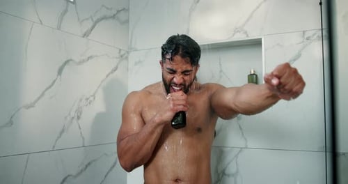 Shirtless Man Singing and Dancing in Shower