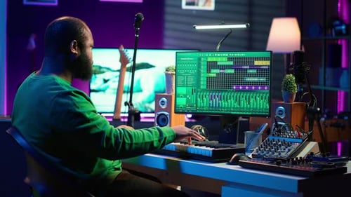 Sound Engineer Pressing Keys of Electronic Synthesizer and Composing New Song