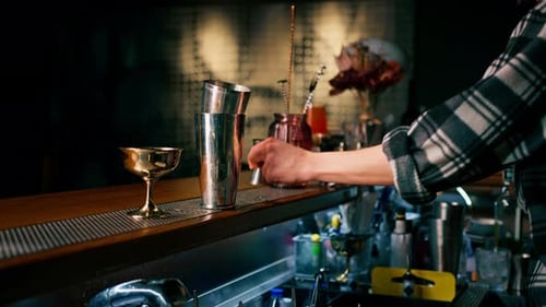 Bartender Prepares Cocktail With Tools on Bar