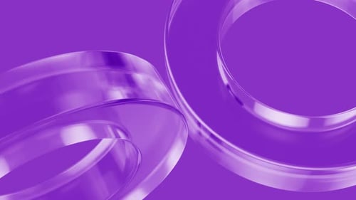 Abstract glass rings rotating on purple background