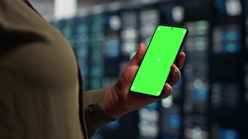 Data Center Programmer Runs Equipment Checkups Using Green Screen Laptop