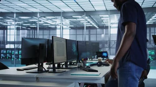 Technician Entering Data Center Tuning Music on and Starting Work on AI
