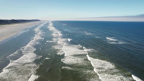 Coastal Aerial View Stretching To Horizon Of Pacific Ocean Off Washington State Beach