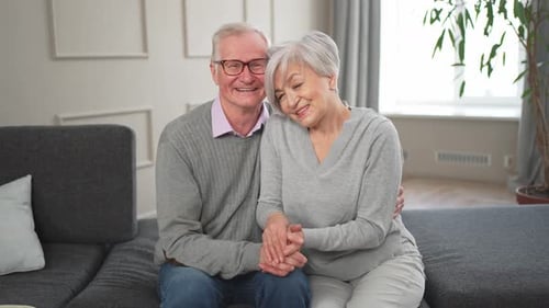 Senior Couple Smiling Together in Home