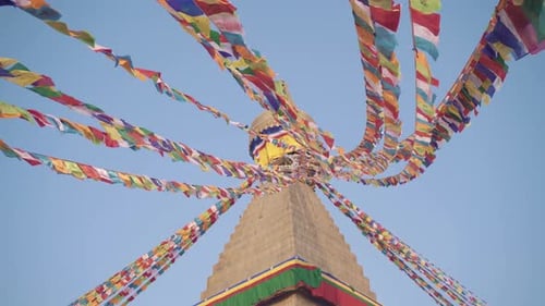 Colorful Tibetan Prayer Flags At Boudhanath Stupa With Clear Blue Sky On The Background In Kathmandu