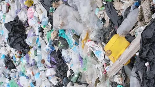 Plastic Waste Environmental Pollution Contaminated Ocean Beaches with Plastic Vertical Video