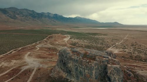 Aerial descent of a hill formation and mountain range