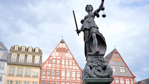 Justice fountain square statue and buildings in Frankfurt, Germany