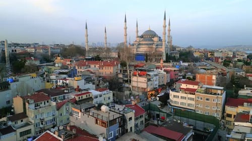 Aerial drone view of Istanbul at sunset, Turkey. The Blue Mosque and Hagia Sophia with gardens and r