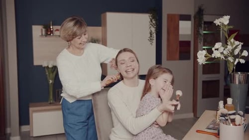 Three Generations of Women at Makeup Table