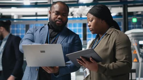 Professionals Working Together Using Technology in Modern Workplace