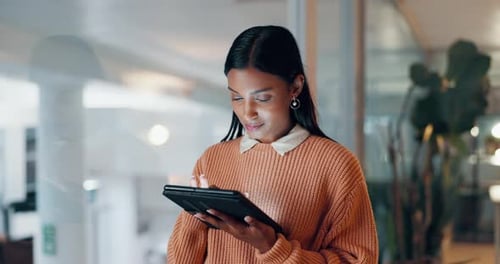 Young Adult Working on Tablet at Night