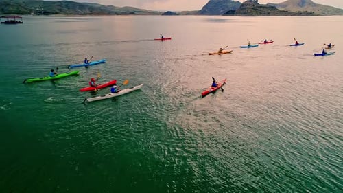 Kayakers Paddle Calm Lake, Aerial View