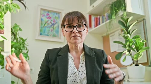 Professional Woman Talking in Bright Home Office