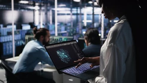 Close Up of Data Center Technician Using Tablet to Monitor Neural Network AI LLM