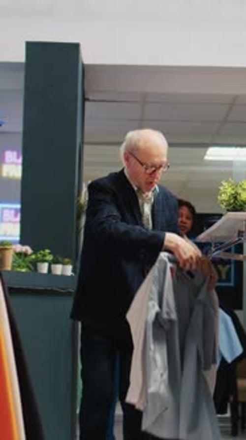 Customers shopping for clothing at a retail store