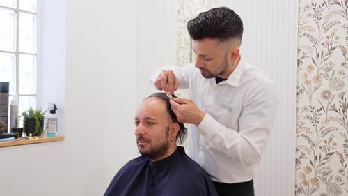 Hair Clinic Technician Performing a Hair Implant Procedure in Slow Motion