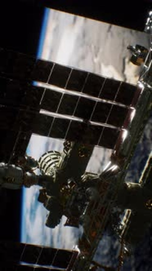 View of the International Space Station Orbiting Earth in Low Sunlight