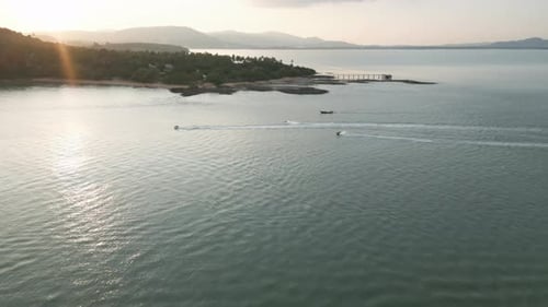 Aerial View of a Sandy Beach Shore with Sailboats in a Thai Bay