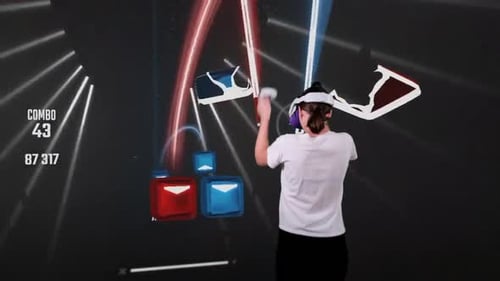 Woman in Virtual Reality Headset Plays an Action Video Game in Augmented Reality