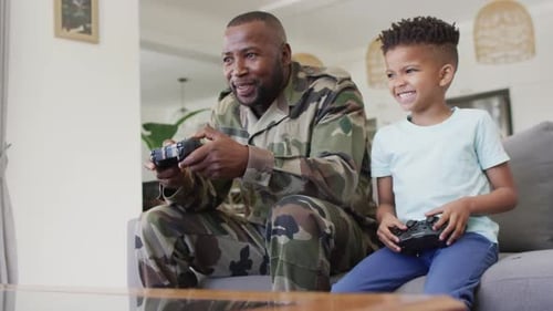 Man and Child Playing Video Games Together