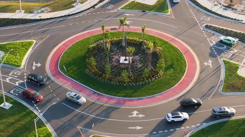 Traffic Circle on American Road with Driving Cars Overhead View of US Roundabout Intersection