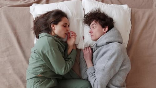 Capture a Heartfelt Moment with a Photo of a Couple in Bed Exuding Love and Intimacy