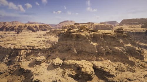 Aerial Flyover Through Arid Desert Rocky Landscape