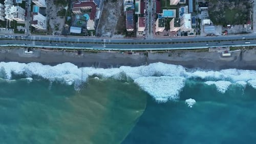 Cars Drives Coastal Road Leading Along the Rocky Beach and the Calm Sea