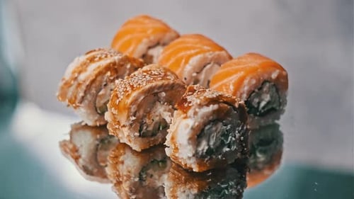 Sushi Rotates on a Mirror Table