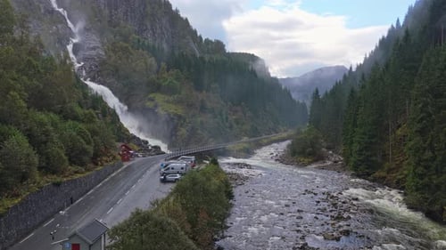 Latefossen falls winding through Norway valley in aerial panorama
