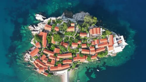 The Adriatic Sea and a beautiful aerial view of the coast and the island of Sveti Stefan.