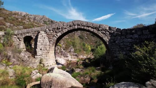 Flying Over Ancient Stone Bridge Over Beautiful River. Amazing Nature Landscape