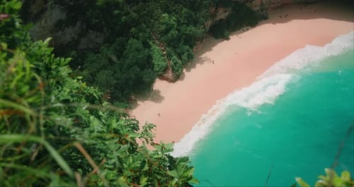 Tropical Beach with Smooth Pink Sand and Mesmerising Azure Ocean Waves Top Down View of Beautiful