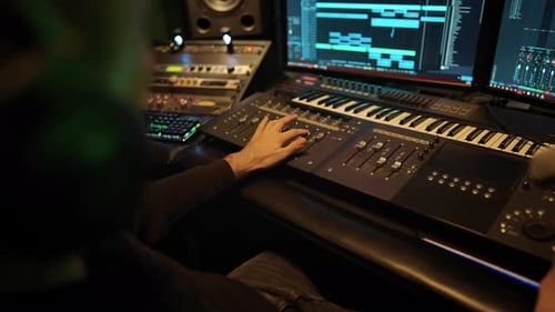 Professional Audio Engineer Using Digital Workstation in Modern Record Studio Music Production in